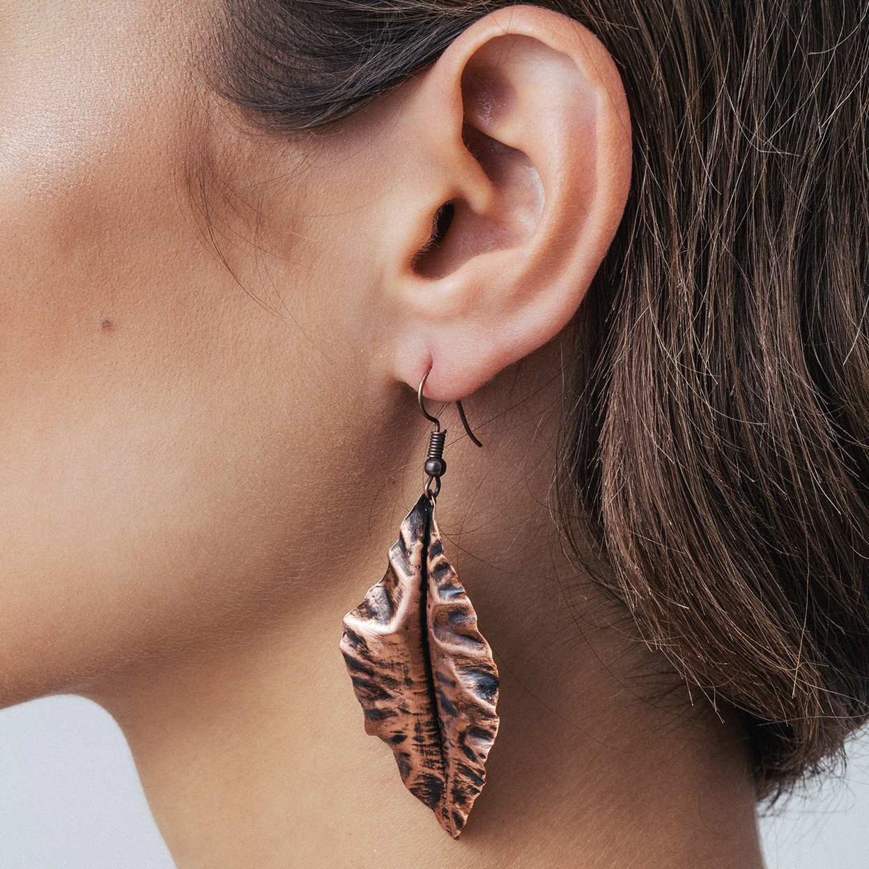 Copper leaf earrings with turquis shape