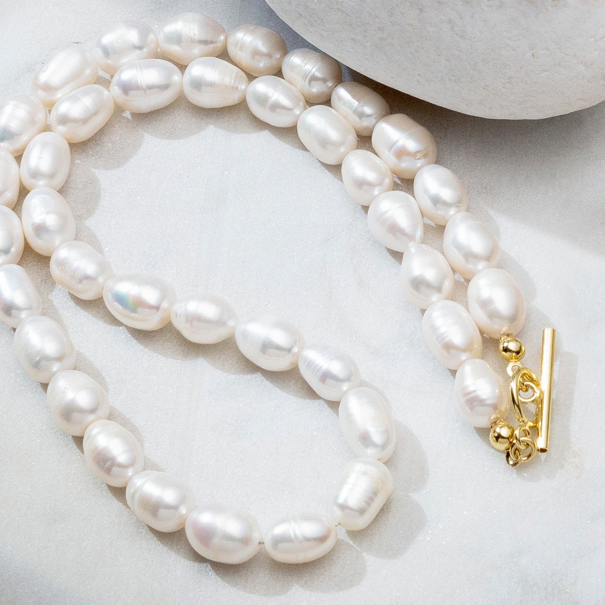Flexible white freshwater pearls, sterling silver 925