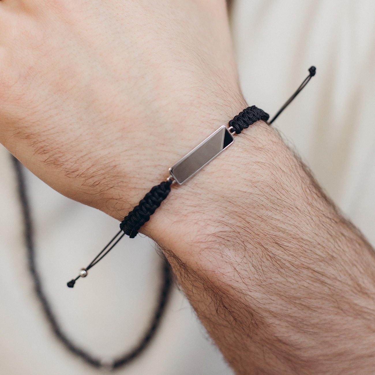 Cord bracelet rectangular tag