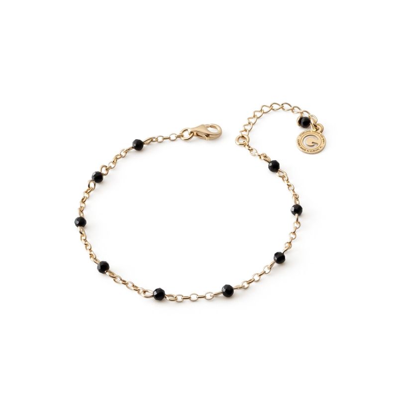 Silver wrist bracelet with black spinel covered in gold