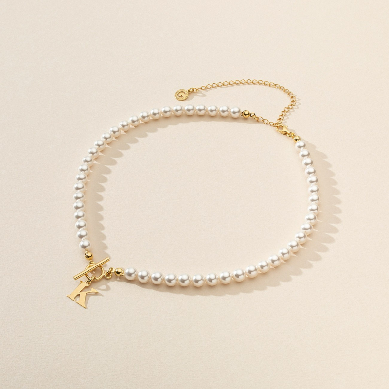 Delicate choker with pearls and letter, 925 silver in gold plating                                    