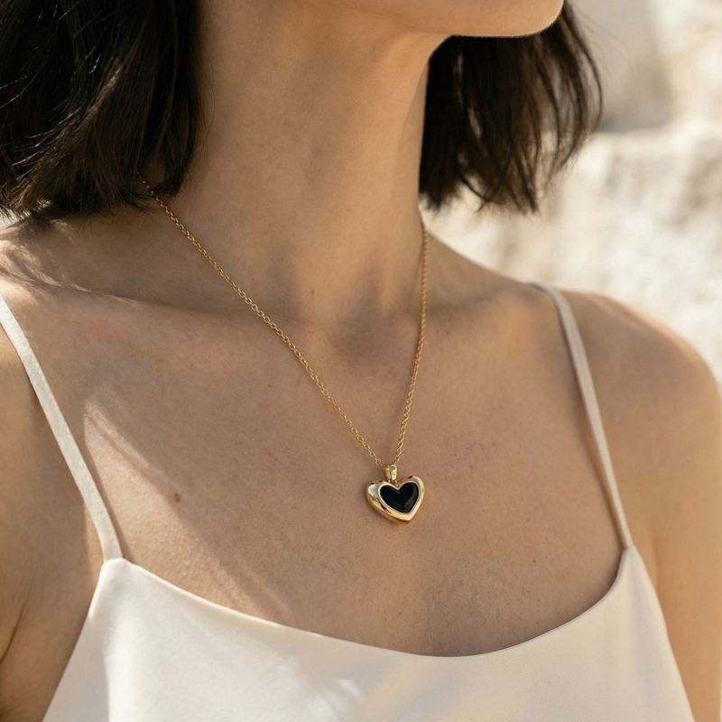 Black resin asymmetrical heart necklace, sterling silver 925, platinum plated                                    