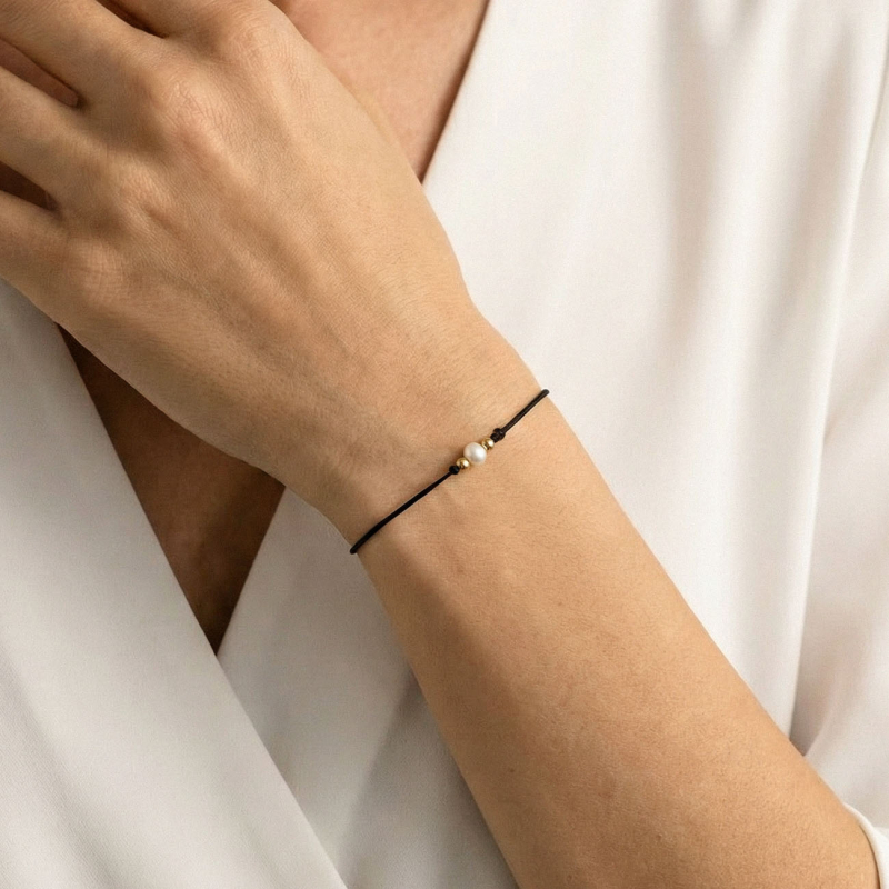 Glücksarmband mit Perle am schwarzen Band, 925er Silber gelbvergoldet                                    